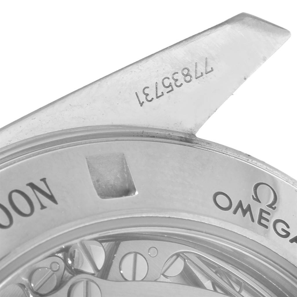 This image shows a close-up of the back case and part of the lug of an Omega Speedmaster 3573.50.00 Men
s Stainless Steel Black Dial 3573.50.00 Men
s Stainless Steel Black Dial watch.