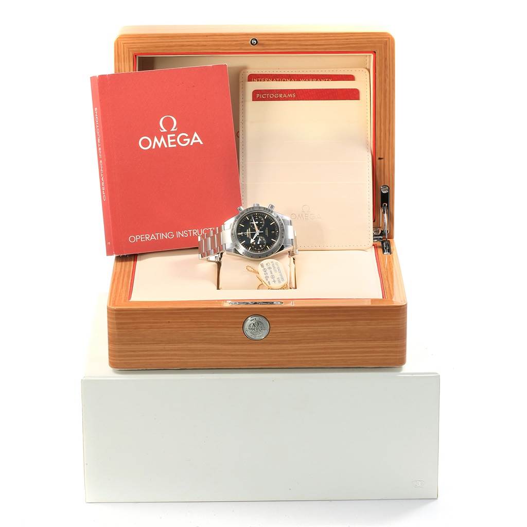 The Omega Speedmaster 331.10.42.51.01.002 Men's Stainless Steel Black Dial 331.10.42.51.01.002 Men's Stainless Steel Black Dial watch is displayed in its wooden box with operating instructions and warranty cards visible.