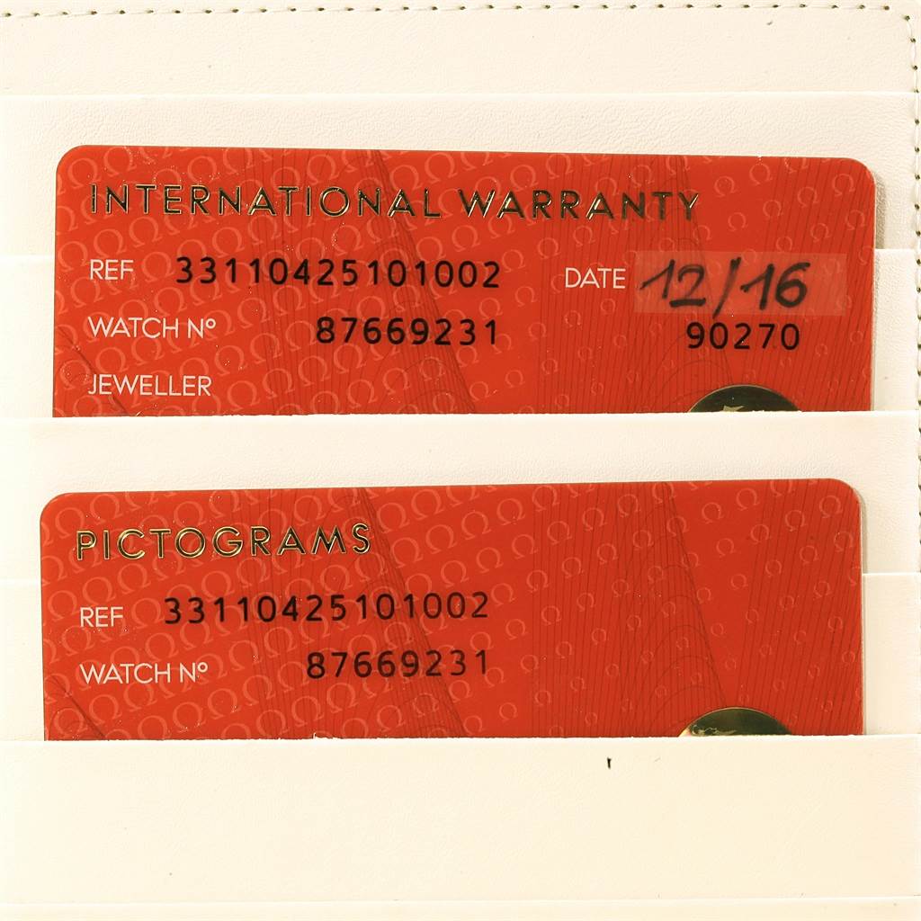 The image shows warranty and pictogram cards for an Omega Speedmaster 331.10.42.51.01.002 Men's Stainless Steel Black Dial 331.10.42.51.01.002 Men's Stainless Steel Black Dial watch, displayed in a slot holder.