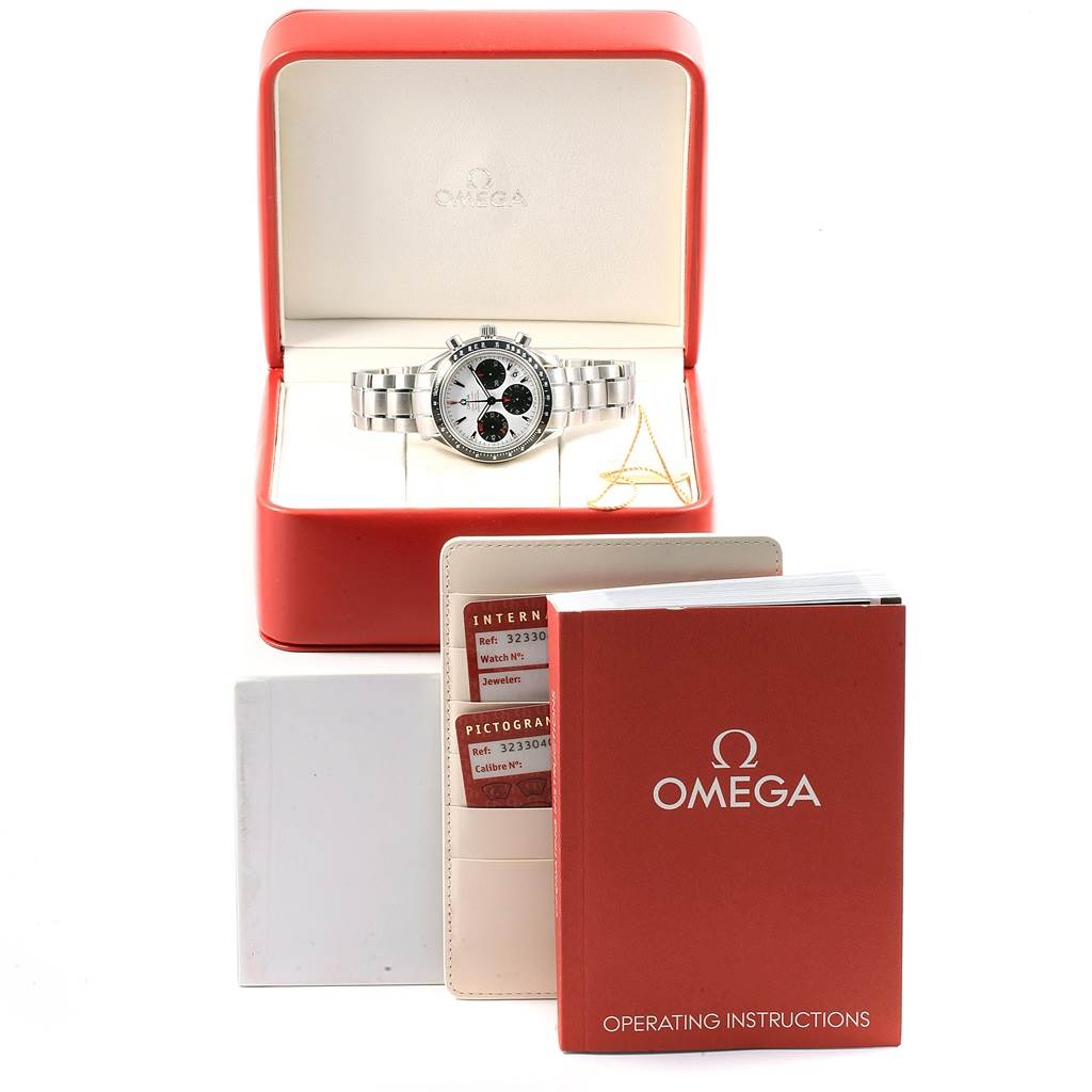 The image shows an Omega Speedmaster 323.30.40.40.04.001 Men's Stainless Steel White Dial 323.30.40.40.04.001 Men's Stainless Steel White Dial watch from the front in its box, along with operating instructions and warranty cards.