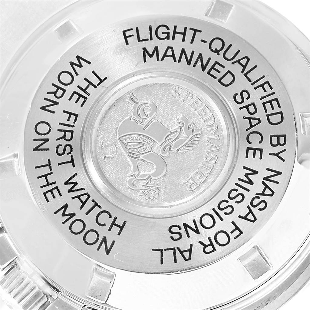 The image shows the back case of the Omega Speedmaster 3575.20.00 Men
s Stainless Steel White Dial 3575.20.00 Men
s Stainless Steel White Dial watch with engraved text and emblem.