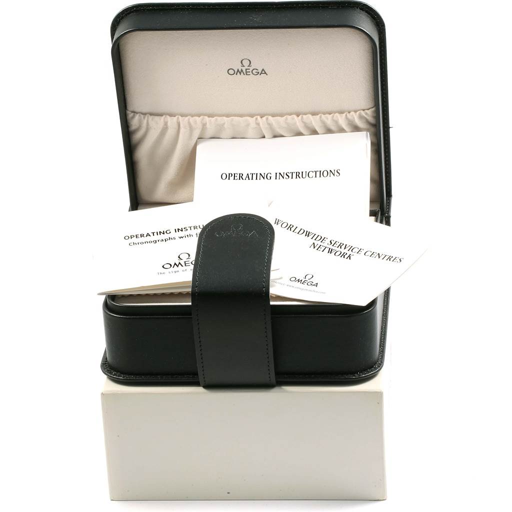 The image shows an Omega Speedmaster 3572.50.00 Men
s Stainless Steel Black Dial 3572.50.00 Men
s Stainless Steel Black Dial watch box containing operating instructions and service network documents.