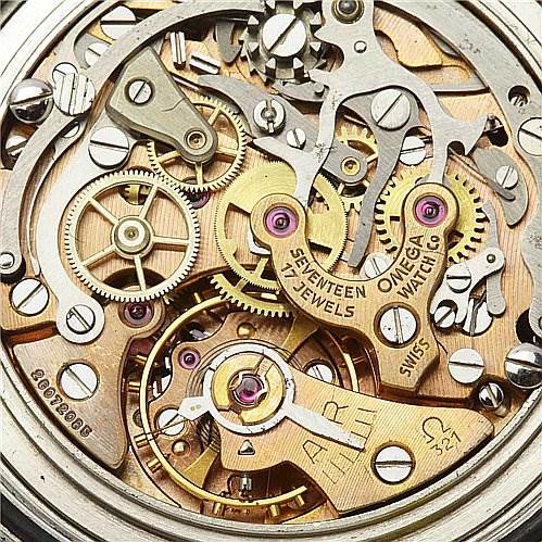 This image shows the intricate internal mechanisms of an Omega Speedmaster Men
s Stainless Steel Black Dial Men
s Stainless Steel Black Dial watch, highlighting its gears and jewels.