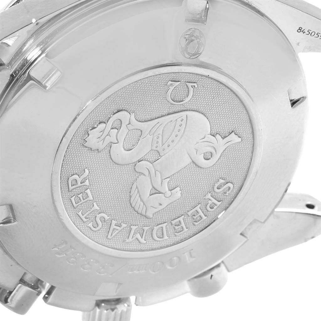 The image shows the caseback of an Omega Speedmaster 3210.52.00 Men
s Stainless Steel Black Dial 3210.52.00 Men
s Stainless Steel Black Dial watch, featuring brand engraving and emblem.