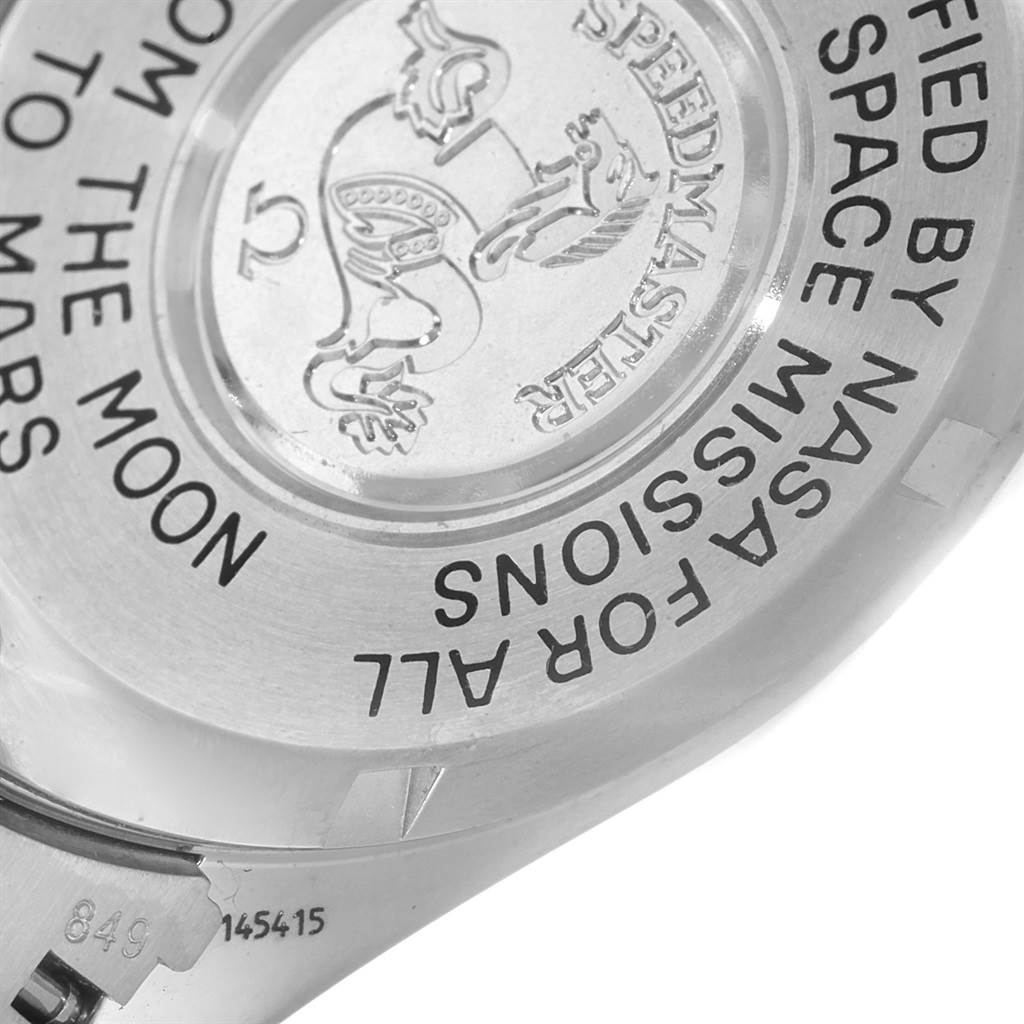 The image shows the back of the Omega Speedmaster 3577.50.00 Men's Stainless Steel Black Dial 3577.50.00 Men's Stainless Steel Black Dial watch, highlighting the engraved text and emblem.