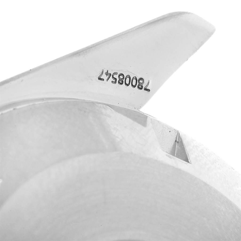 This image shows a close-up of the Omega Speedmaster 3551.50.00 Men
s Stainless Steel Black Dial 3551.50.00 Men
s Stainless Steel Black Dial
s case back, focusing on its serial number engraving.