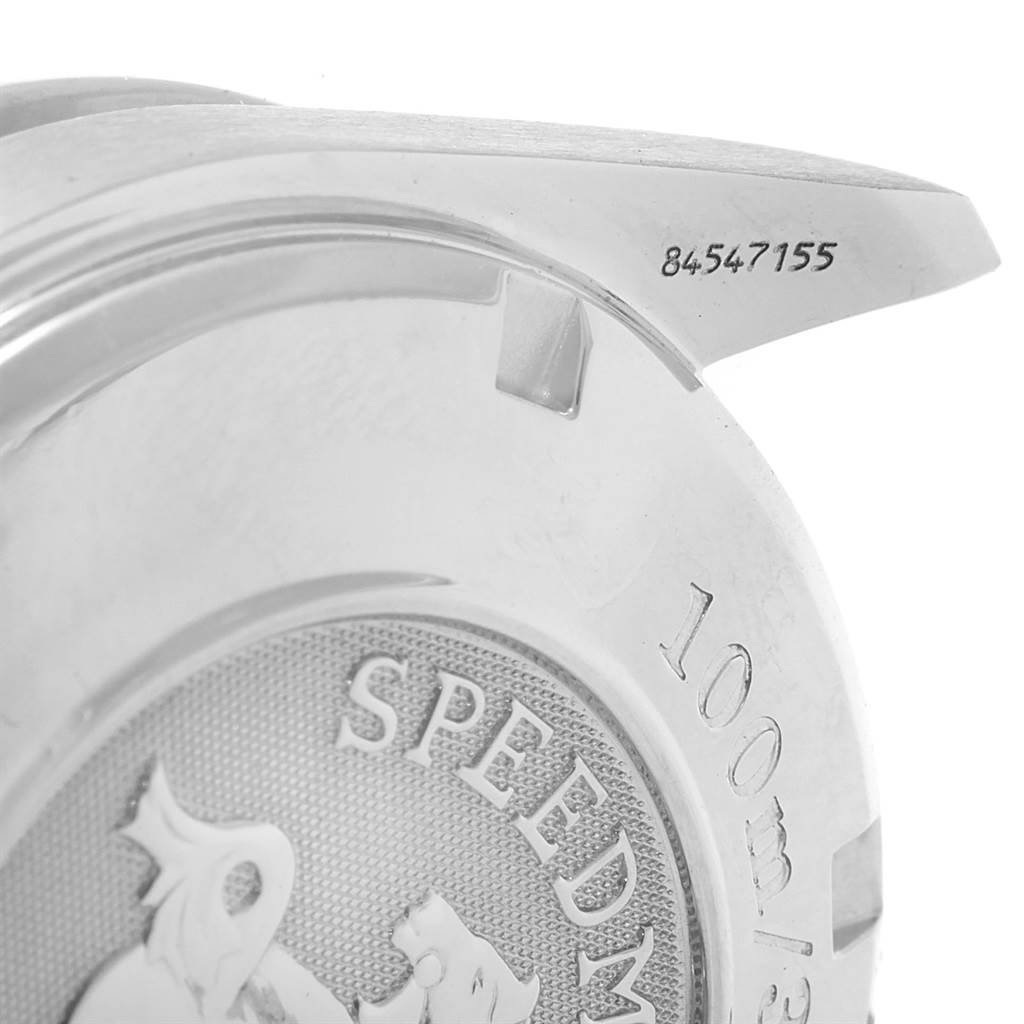 The image shows the back case of an Omega Speedmaster 3211.50.00 Men
s Stainless Steel Black Dial 3211.50.00 Men
s Stainless Steel Black Dial watch, highlighting the engraved text and part of the case back design.