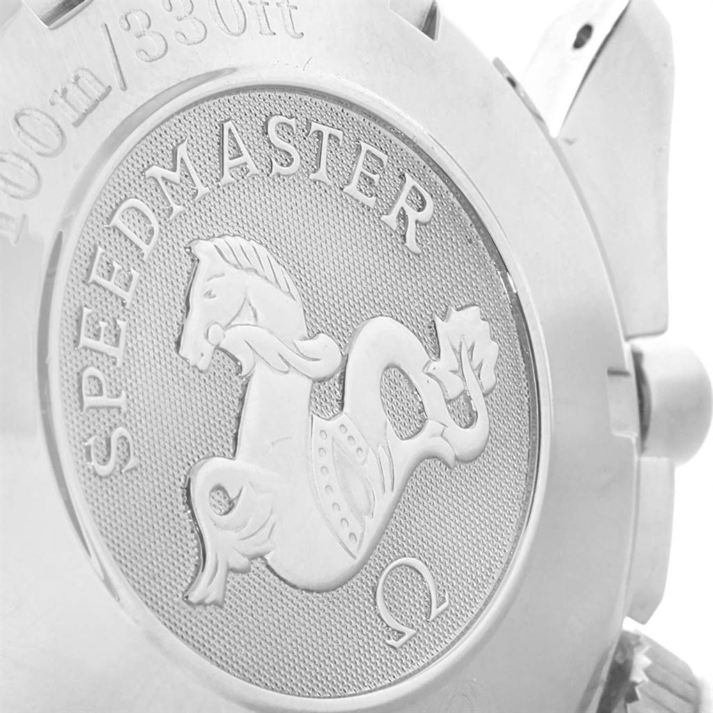 This image shows the backside of an Omega Speedmaster 3210.52.00 Men
s Stainless Steel Black Dial 3210.52.00 Men
s Stainless Steel Black Dial watch, highlighting the emblem and engraved text.