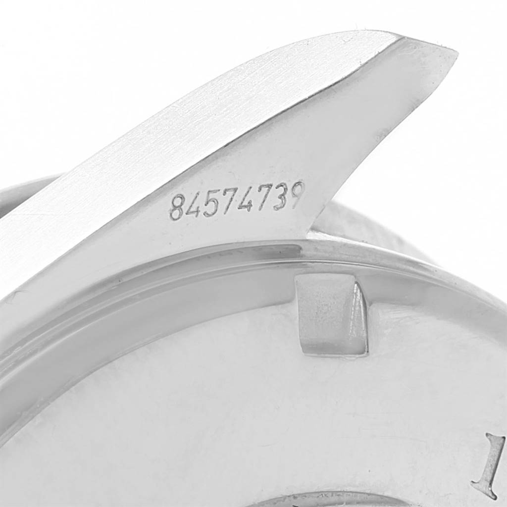 This image shows a close-up of a lug and part of the case back of an Omega Speedmaster 3210.52.00 Men
s Stainless Steel Black Dial 3210.52.00 Men
s Stainless Steel Black Dial watch, featuring its serial number.