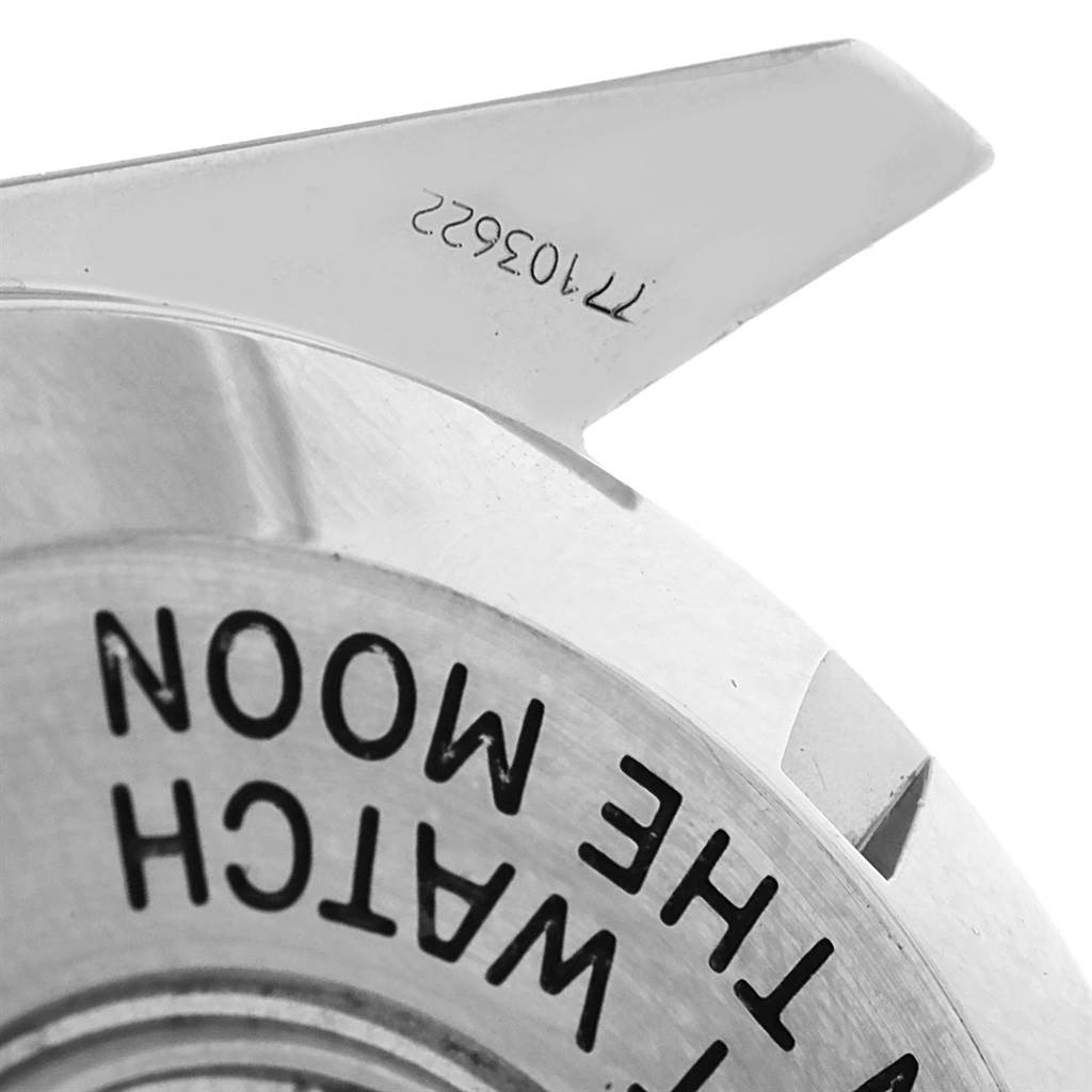 This is a close-up of the back case of the Omega Speedmaster 3570.50.00 Men
s Stainless Steel Black Dial 3570.50.00 Men
s Stainless Steel Black Dial watch, showing partial engravings.