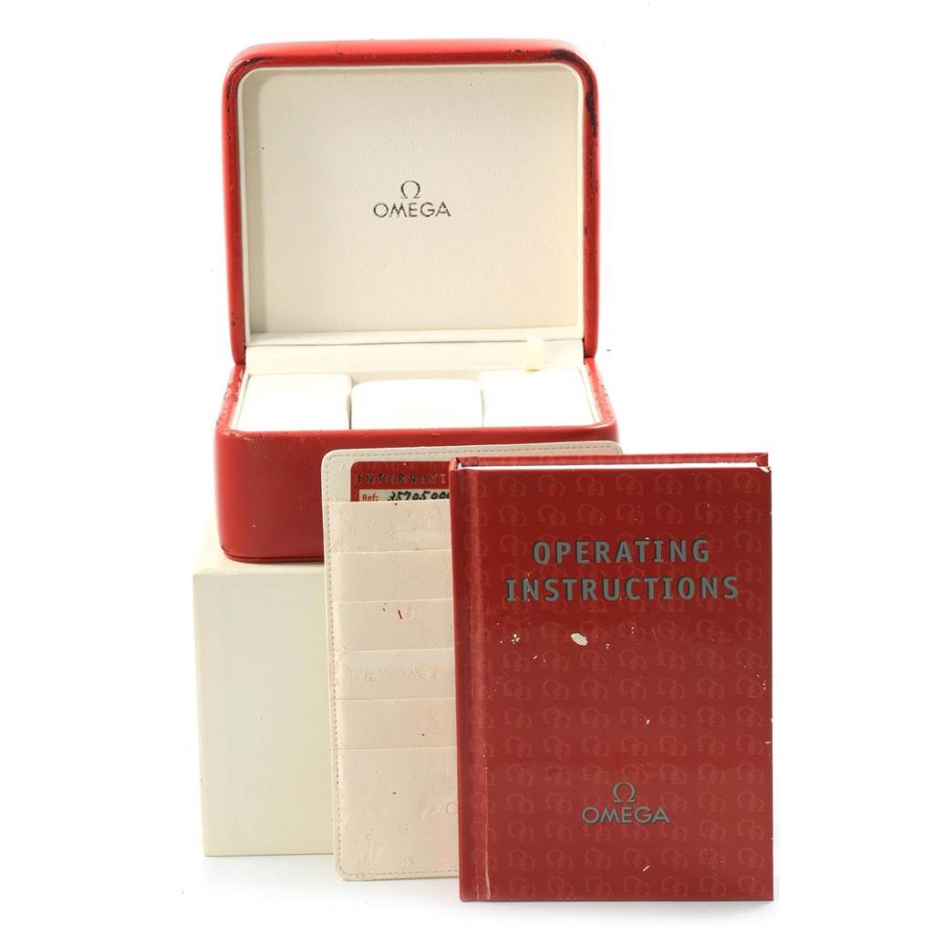 The image shows the packaging, operating instructions, and warranty card for the Omega Speedmaster 3570.50.00 Men
s Stainless Steel Black Dial 3570.50.00 Men
s Stainless Steel Black Dial watch.