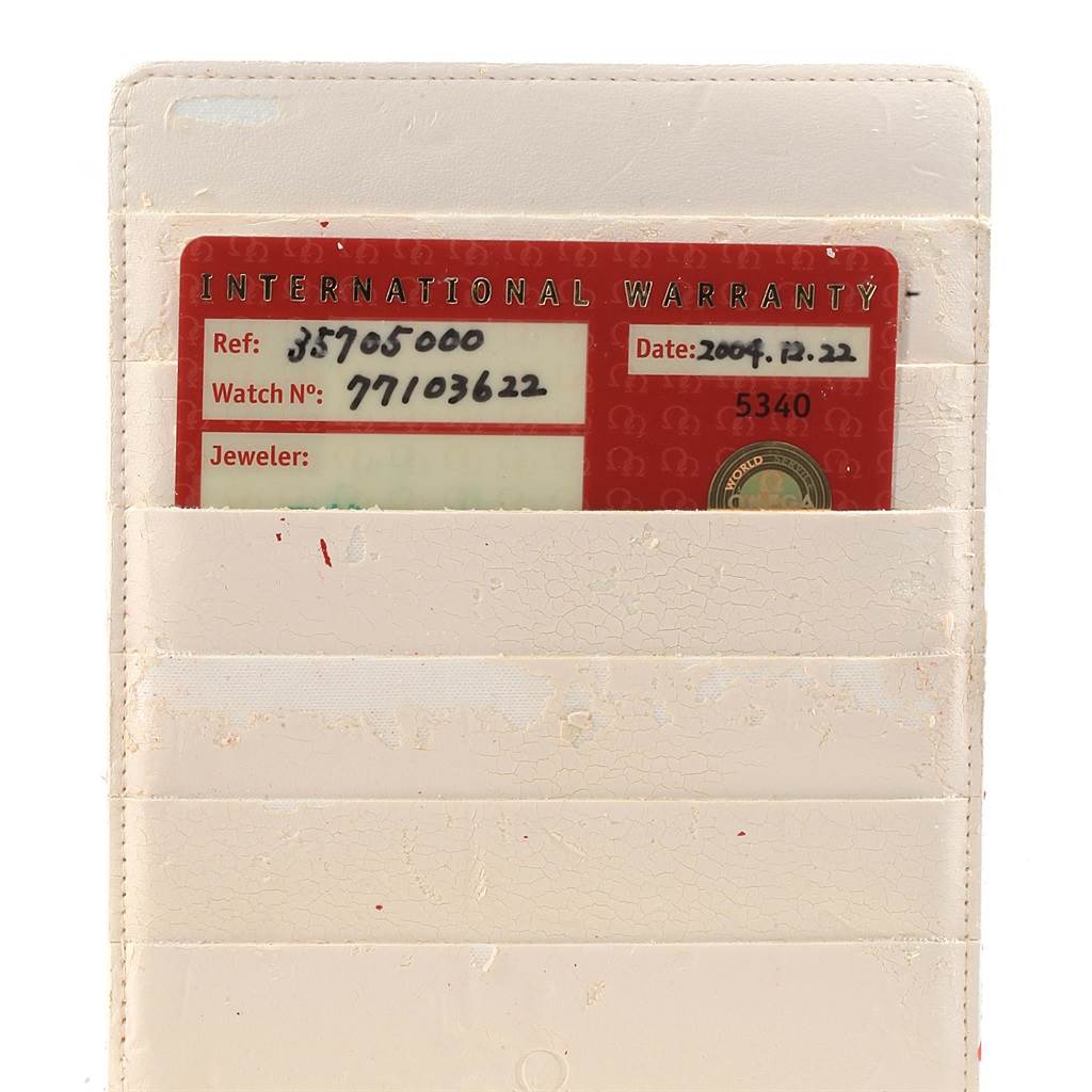 The image shows the warranty card for the Omega Speedmaster 3570.50.00 Men
s Stainless Steel Black Dial 3570.50.00 Men
s Stainless Steel Black Dial model, placed in a white holder.