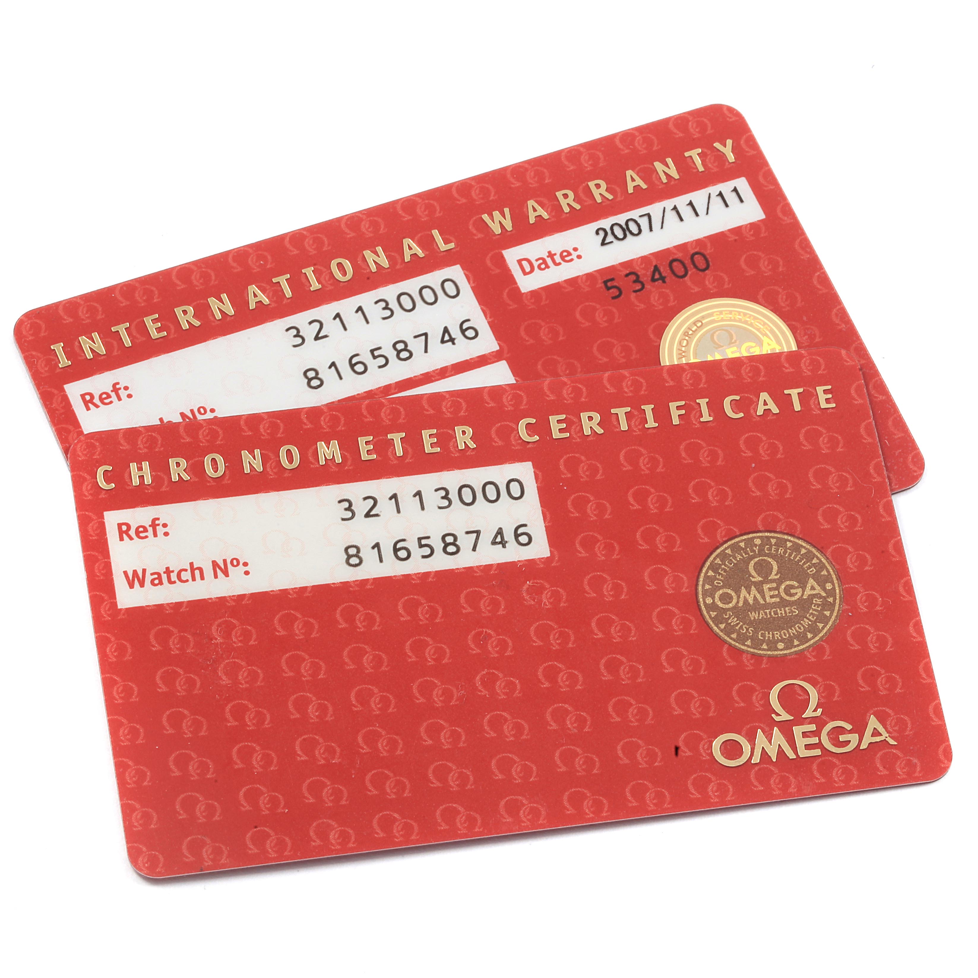 The image shows international warranty and chronometer certificate cards for an Omega Speedmaster 3211.30.00 Men
s Stainless Steel Silver Dial 3211.30.00 Men
s Stainless Steel Silver Dial watch.