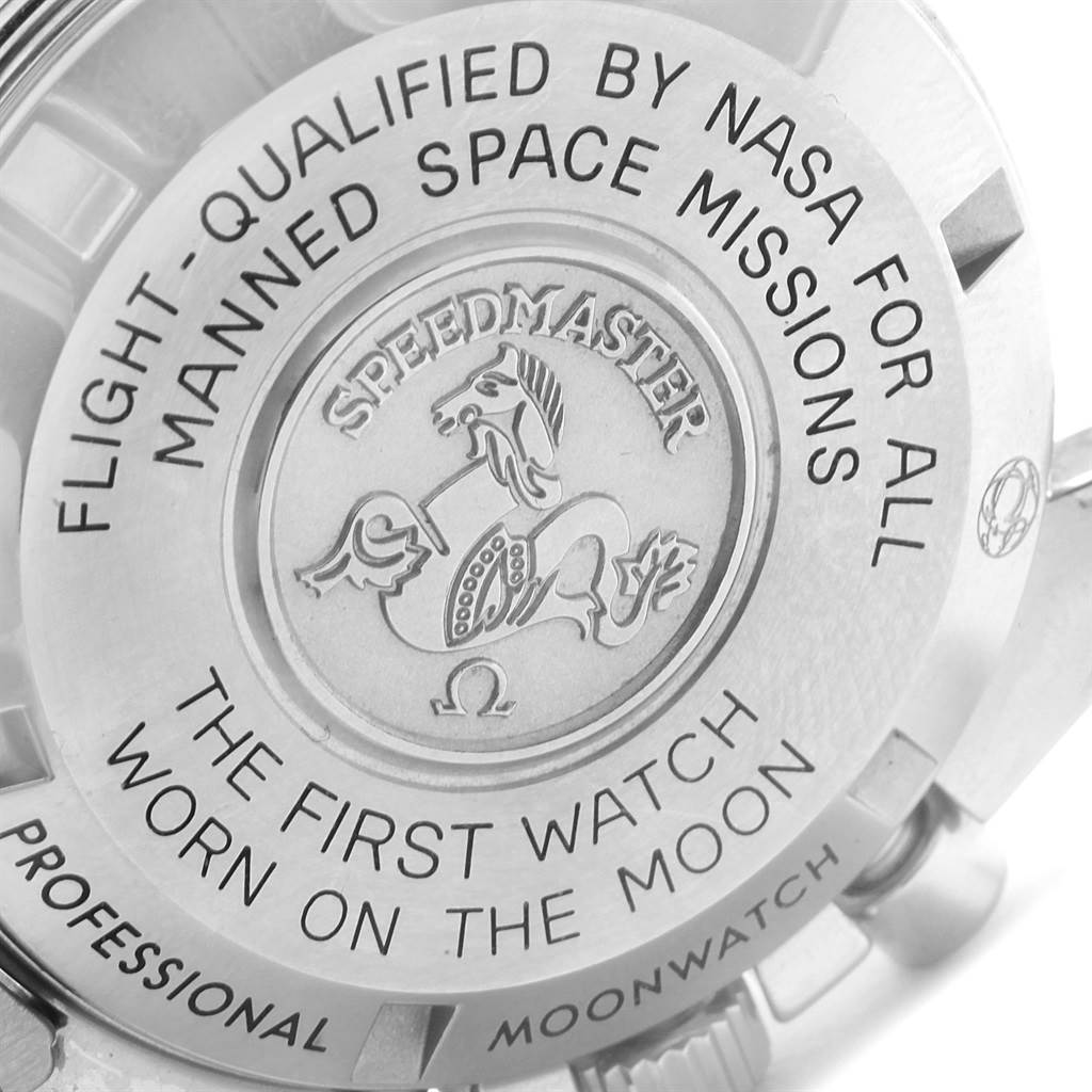 The image shows the case back of the Omega Speedmaster 311.30.42.30.01.005 Men
s Stainless Steel Black Dial 311.30.42.30.01.005 Men
s Stainless Steel Black Dial, highlighting its engravings about NASA qualification and moon landing.