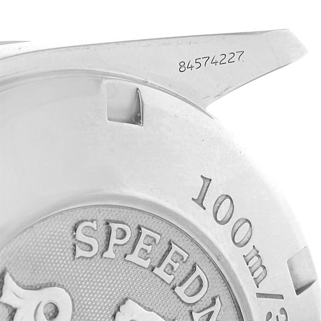 This image shows a close-up of the back case and lug of an Omega Speedmaster 3212.80.00 Men
s Stainless Steel Blue Dial 3212.80.00 Men
s Stainless Steel Blue Dial watch, highlighting the engraving and details.