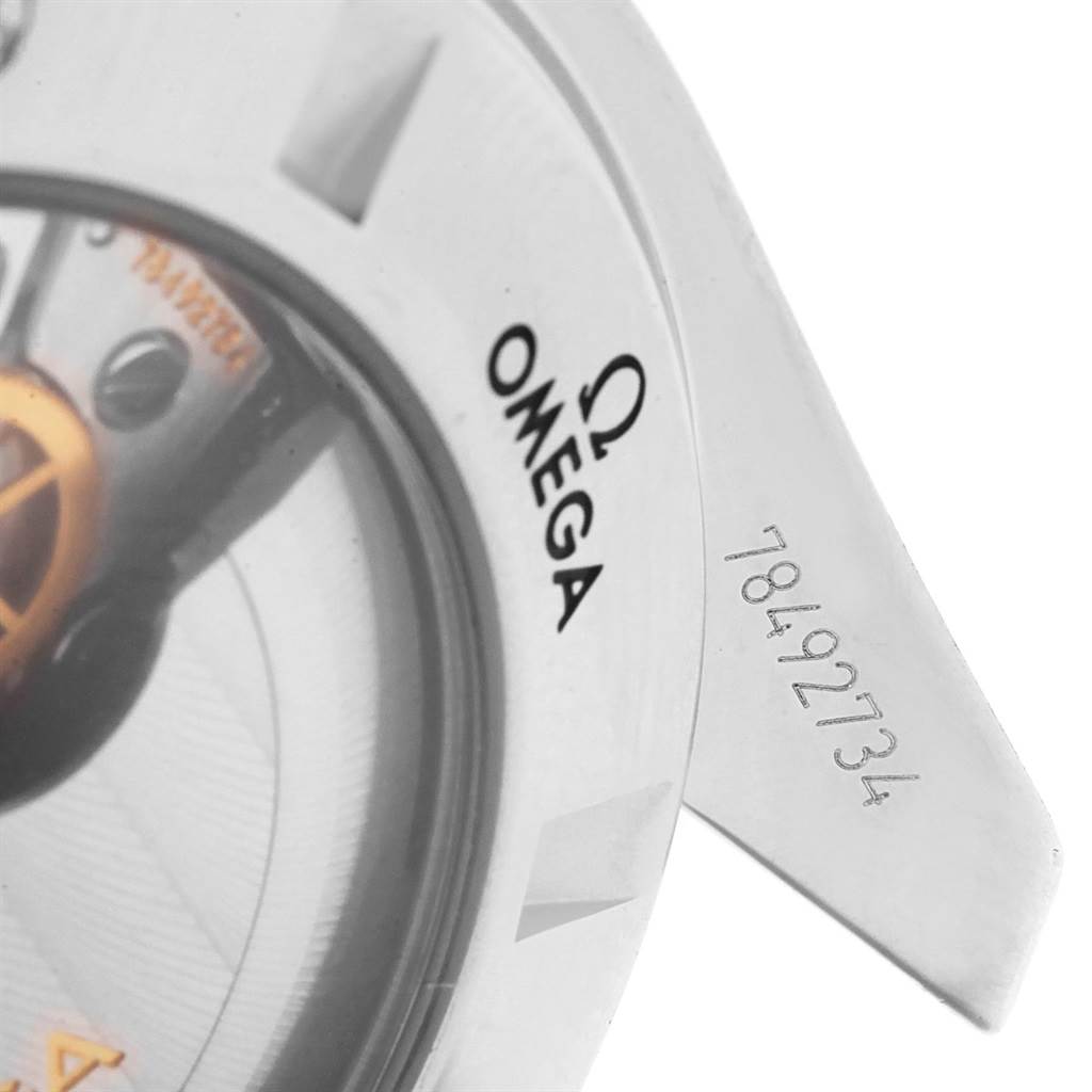 This close-up shows a portion of the Omega Speedmaster 321.13.44.50.02.001 Men
s Stainless Steel Silver Dial 321.13.44.50.02.001 Men
s Stainless Steel Silver Dial
s bezel, screw, and model number engraving.