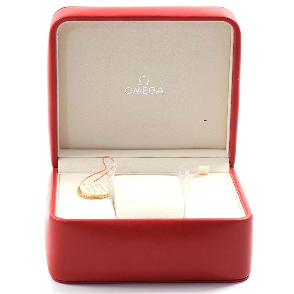 The image shows an open Omega Speedmaster 321.13.44.50.02.001 Men
s Stainless Steel Silver Dial 321.13.44.50.02.001 Men
s Stainless Steel Silver Dial watch box with the inner velvet cushioning and a tag visible.