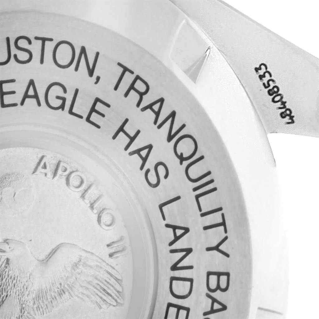 This image shows a close-up of the case back of an Omega Speedmaster 3560.50.00 Men
s Stainless Steel Black Dial 3560.50.00 Men
s Stainless Steel Black Dial, featuring Apollo 11 mission text and engraving.