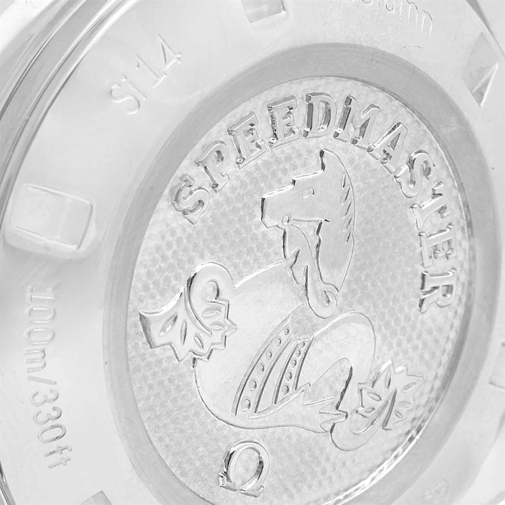 The image shows a close-up of the case back of the Omega Speedmaster 327.10.43.50.06.001 Men
s Stainless Steel Grey Dial 327.10.43.50.06.001 Men
s Stainless Steel Grey Dial watch featuring the engraved branding and logo.