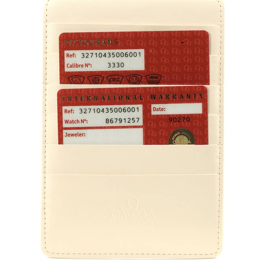 This image shows the pictograms and international warranty cards for the Omega Speedmaster 327.10.43.50.06.001 Men
s Stainless Steel Grey Dial 327.10.43.50.06.001 Men
s Stainless Steel Grey Dial, inside a cream-colored holder.