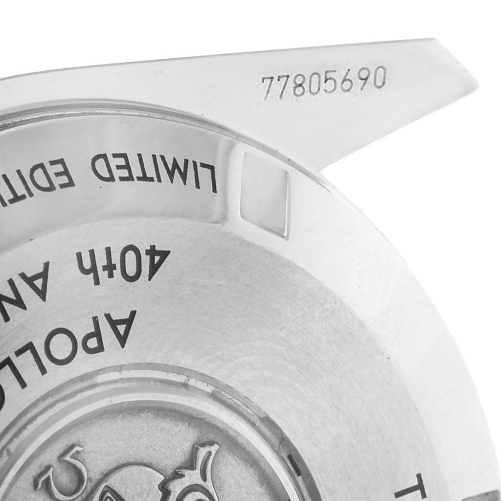 This image shows the back casing of an Omega Speedmaster 311.30.42.30.99.002 Men's Stainless Steel Silver Dial 311.30.42.30.99.002 Men's Stainless Steel Silver Dial watch at an oblique angle, highlighting the "LIMITED EDITION," "40th ANNIVERSARY," and serial number.