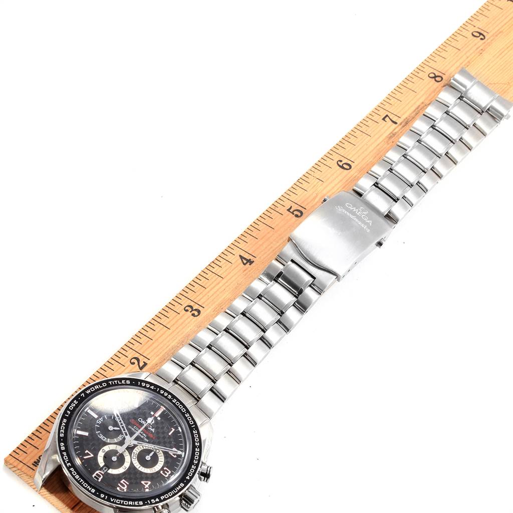 The Omega Speedmaster 321.30.44.50.01.001 Men
s Stainless Steel Black Dial 321.30.44.50.01.001 Men
s Stainless Steel Black Dial watch is displayed flat alongside a ruler, showing its face, bracelet, and clasp.