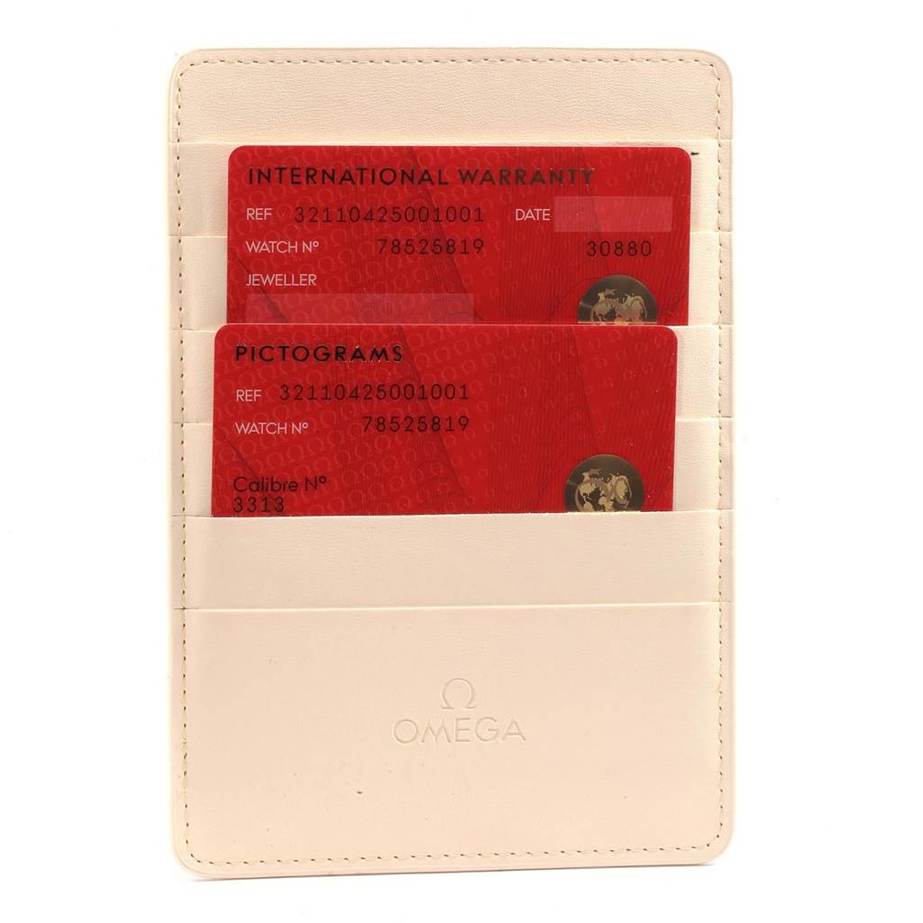 The image shows the international warranty and pictograms cards for an Omega Speedmaster 321.10.42.50.01.001 Men
s Stainless Steel Black Dial 321.10.42.50.01.001 Men
s Stainless Steel Black Dial watch in a cardholder.