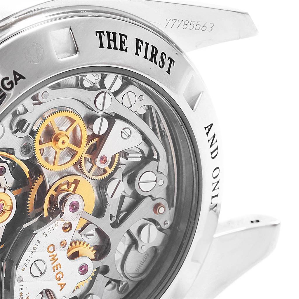 The image shows a close-up of the Omega Speedmaster 311.30.42.30.13.001 Men's Stainless Steel Brown Dial 311.30.42.30.13.001 Men's Stainless Steel Brown Dial's intricate movement from the back, highlighting gears and inner mechanisms.