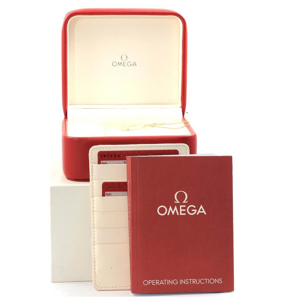 The image shows an Omega Speedmaster 3210.50.00 Men
s Stainless Steel Black Dial 3210.50.00 Men
s Stainless Steel Black Dial watch box, warranty card holder, and operating instructions, taken from the front angle.