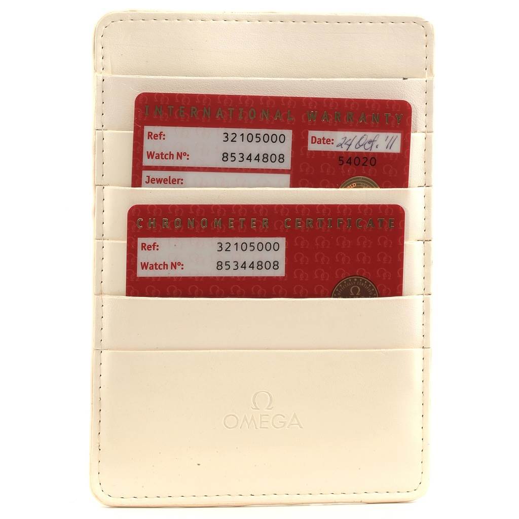 The image shows warranty and chronometer certificate cards in a leather cardholder for the Omega Speedmaster 3210.50.00 Men
s Stainless Steel Black Dial 3210.50.00 Men
s Stainless Steel Black Dial watch.