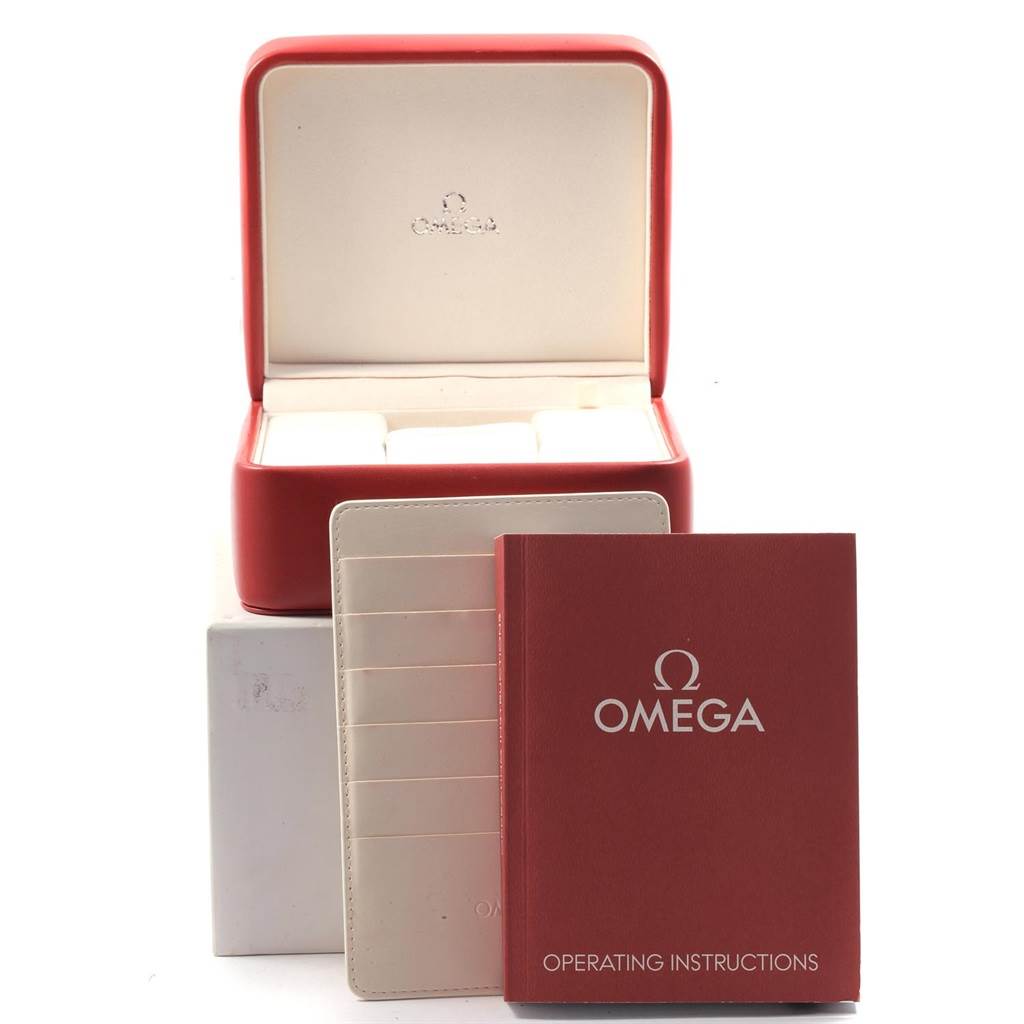 This image shows a red Omega Speedmaster 321.10.44.50.02.001 Men
s Stainless Steel Silver Dial 321.10.44.50.02.001 Men
s Stainless Steel Silver Dial watch box, an instruction manual, and a cardholder.