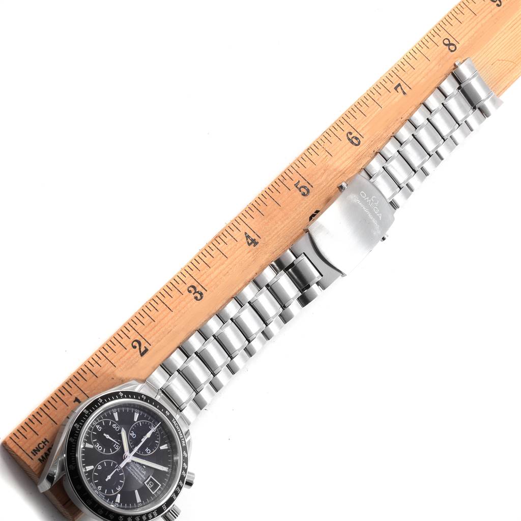 The image shows the face and band of an Omega Speedmaster 3210.50.00 Men
s Stainless Steel Black Dial 3210.50.00 Men
s Stainless Steel Black Dial watch, placed beside a ruler for scale.