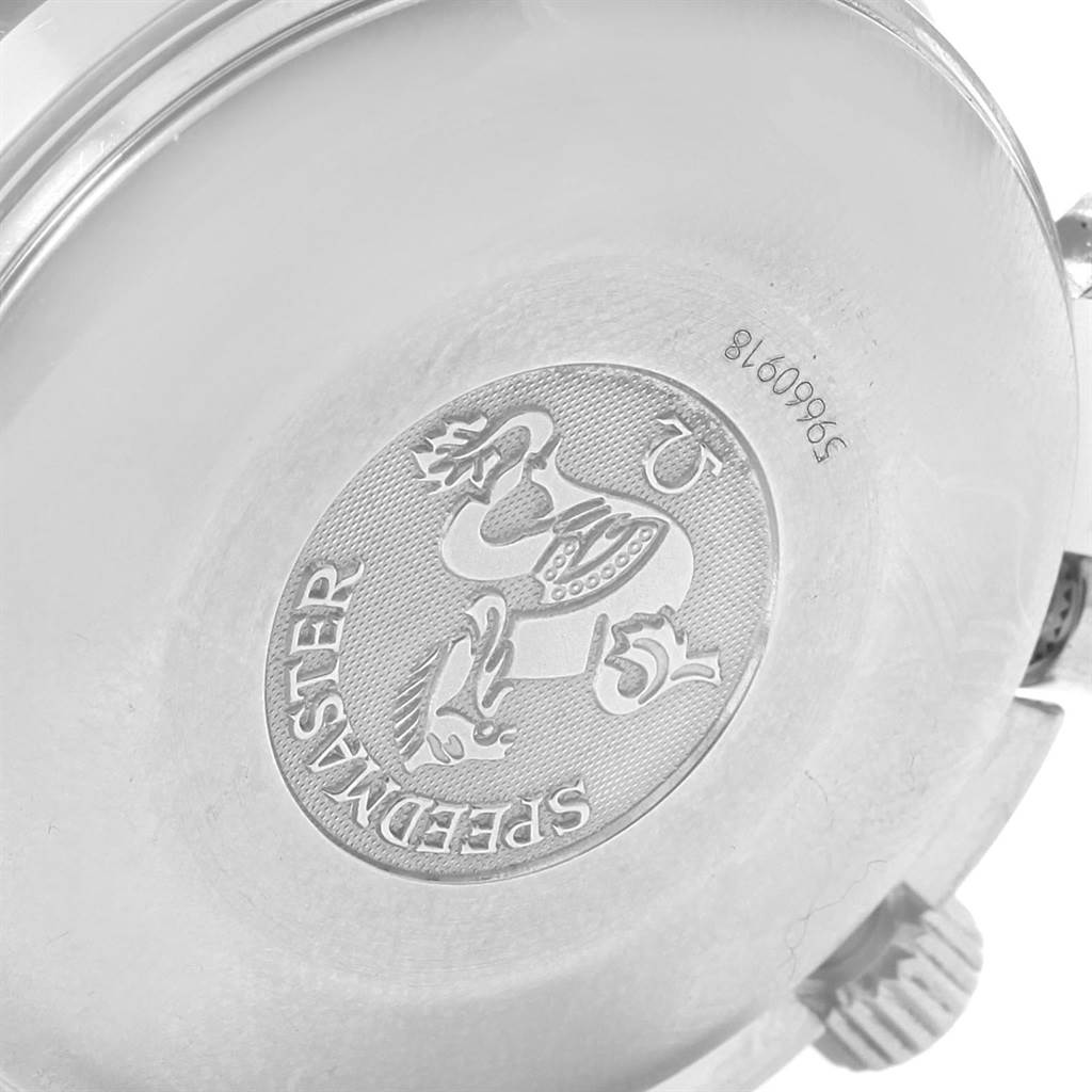 This image shows the back case of an Omega Speedmaster 3523.80.00 Men
s Stainless Steel Blue Dial 3523.80.00 Men
s Stainless Steel Blue Dial watch, highlighting the engraved emblem and serial number.