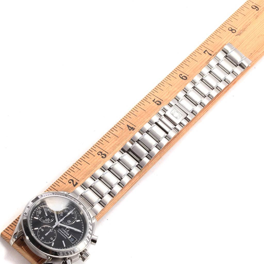 The image shows an Omega Speedmaster 3513.50.00 Men
s Stainless Steel Black Dial 3513.50.00 Men
s Stainless Steel Black Dial watch, displayed flat with a ruler for measurement, highlighting the face and metal bracelet.