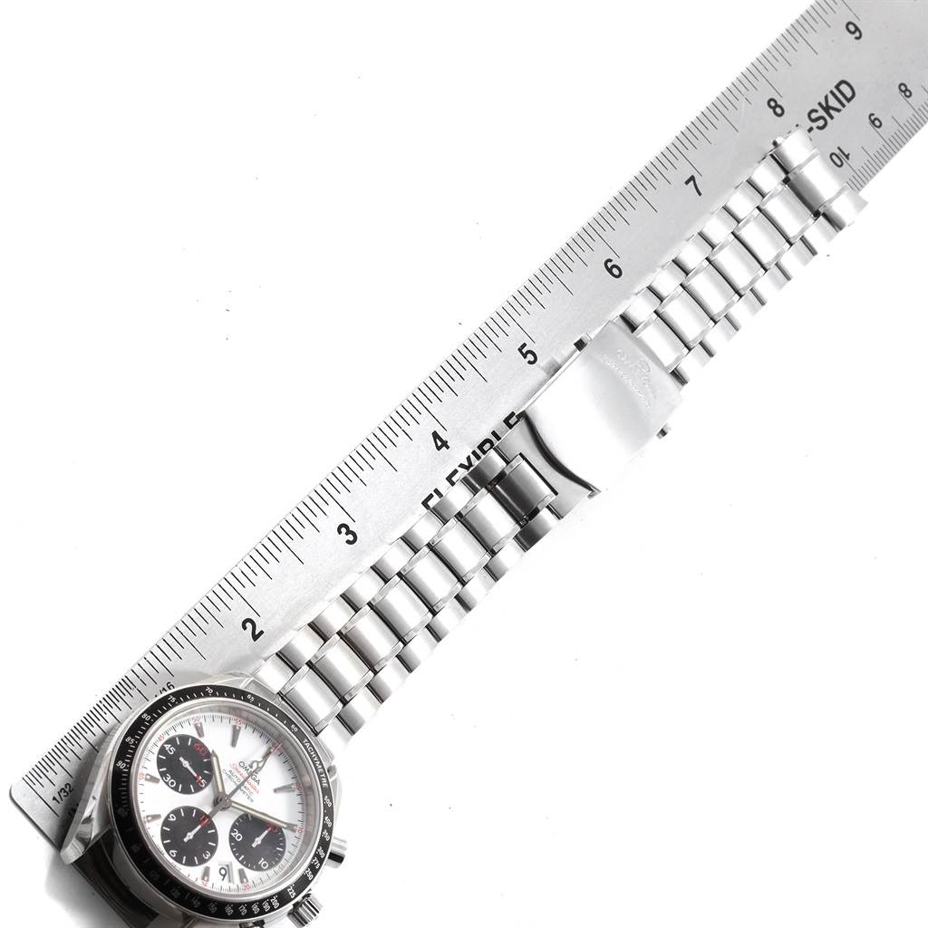 The image shows an Omega Speedmaster 323.30.40.40.04.001 Men
s Stainless Steel White Dial 323.30.40.40.04.001 Men
s Stainless Steel White Dial watch, partially visible with a focus on its metal bracelet and a ruler for scale.