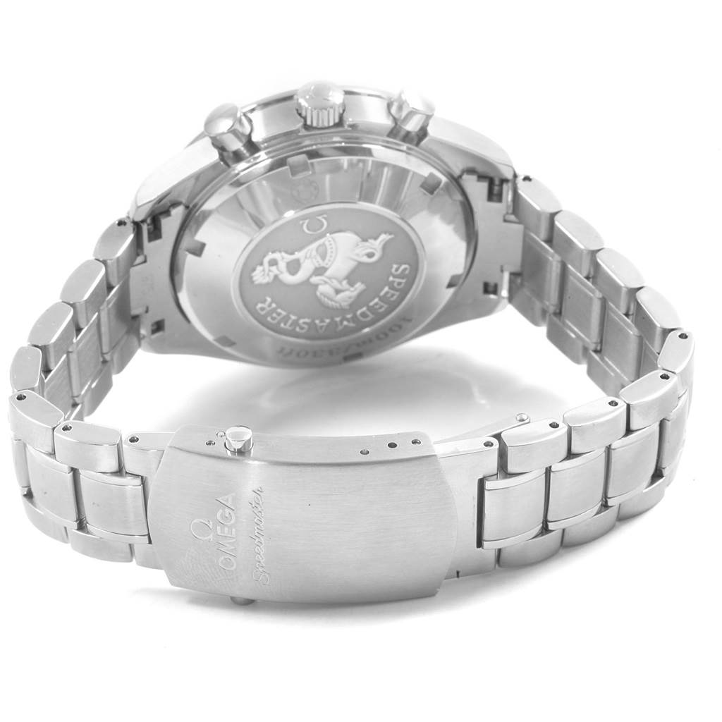 The image shows the back case and bracelet clasp of an Omega Speedmaster 3211.30.00 Men
s Stainless Steel Silver Dial 3211.30.00 Men
s Stainless Steel Silver Dial watch, displaying the engraved logo and writing.