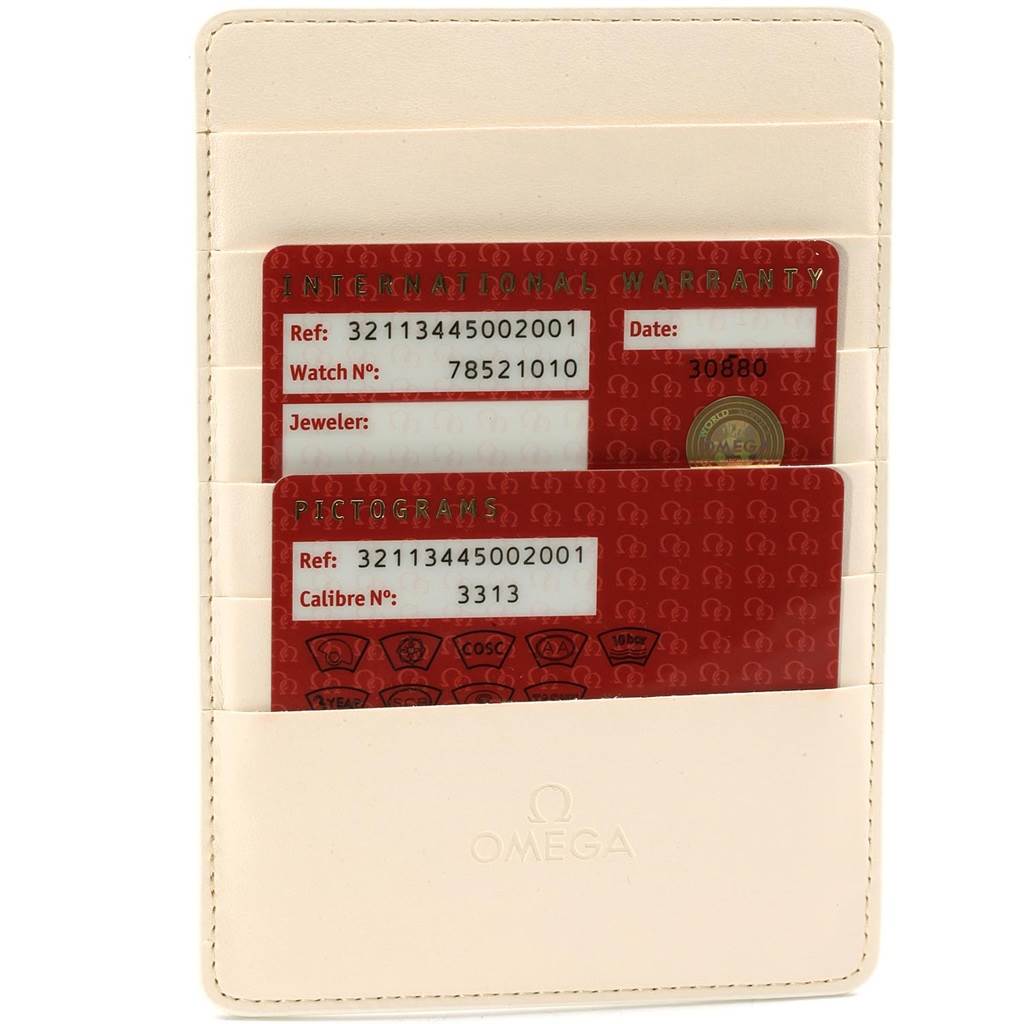 The image shows international warranty and pictogram cards in a card holder for the Omega Speedmaster 321.13.44.50.02.001 Men
s Stainless Steel Silver Dial 321.13.44.50.02.001 Men
s Stainless Steel Silver Dial model.
