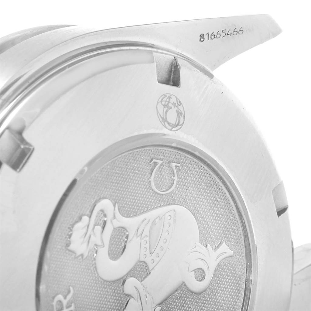 The image shows the back casing and part of the lugs of the Omega Speedmaster 3222.80.00 Men
s Stainless Steel Blue Dial 3222.80.00 Men
s Stainless Steel Blue Dial watch, including engraved details and serial number.