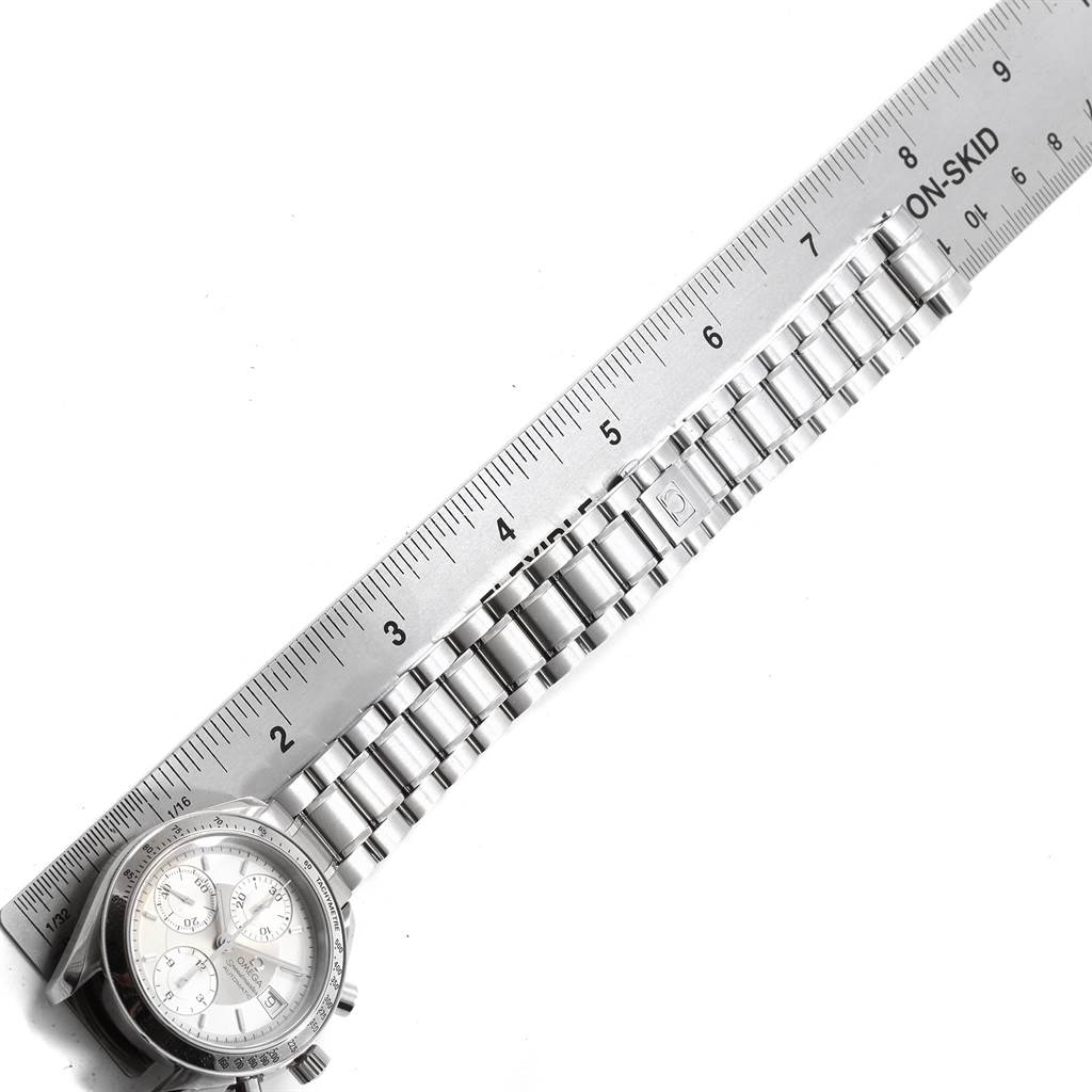 The image shows the face and bracelet of an Omega Speedmaster 3513.30.00 Men
s Stainless Steel Silver Dial 3513.30.00 Men
s Stainless Steel Silver Dial watch, measured with a ruler.