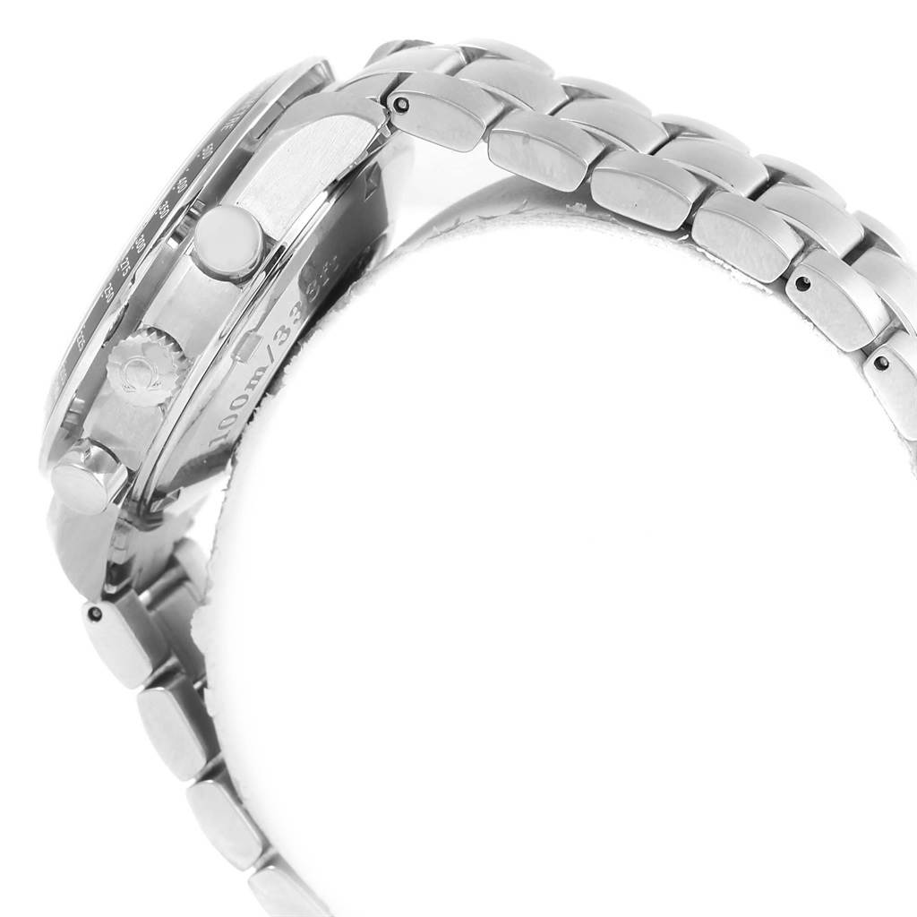 The image shows a side angle of an Omega Speedmaster 3212.80.00 Men
s Stainless Steel Blue Dial 3212.80.00 Men
s Stainless Steel Blue Dial watch, highlighting the case, bracelet, crown, and pushers.