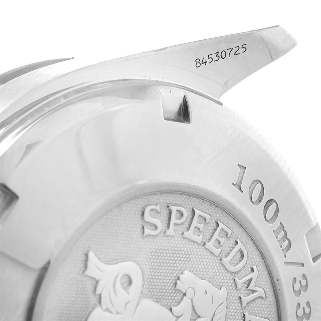 This image shows a close-up of the back case of an Omega Speedmaster 3212.80.00 Men
s Stainless Steel Blue Dial 3212.80.00 Men
s Stainless Steel Blue Dial watch, highlighting model details and engraving.