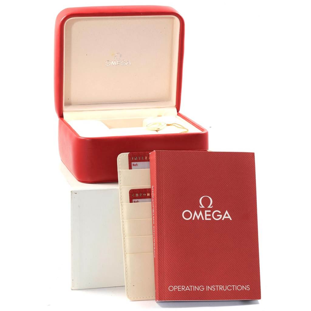 The image shows the Omega Speedmaster 3212.80.00 Men
s Stainless Steel Blue Dial 3212.80.00 Men
s Stainless Steel Blue Dial packaging, including the red box, operation manual, and warranty cards.