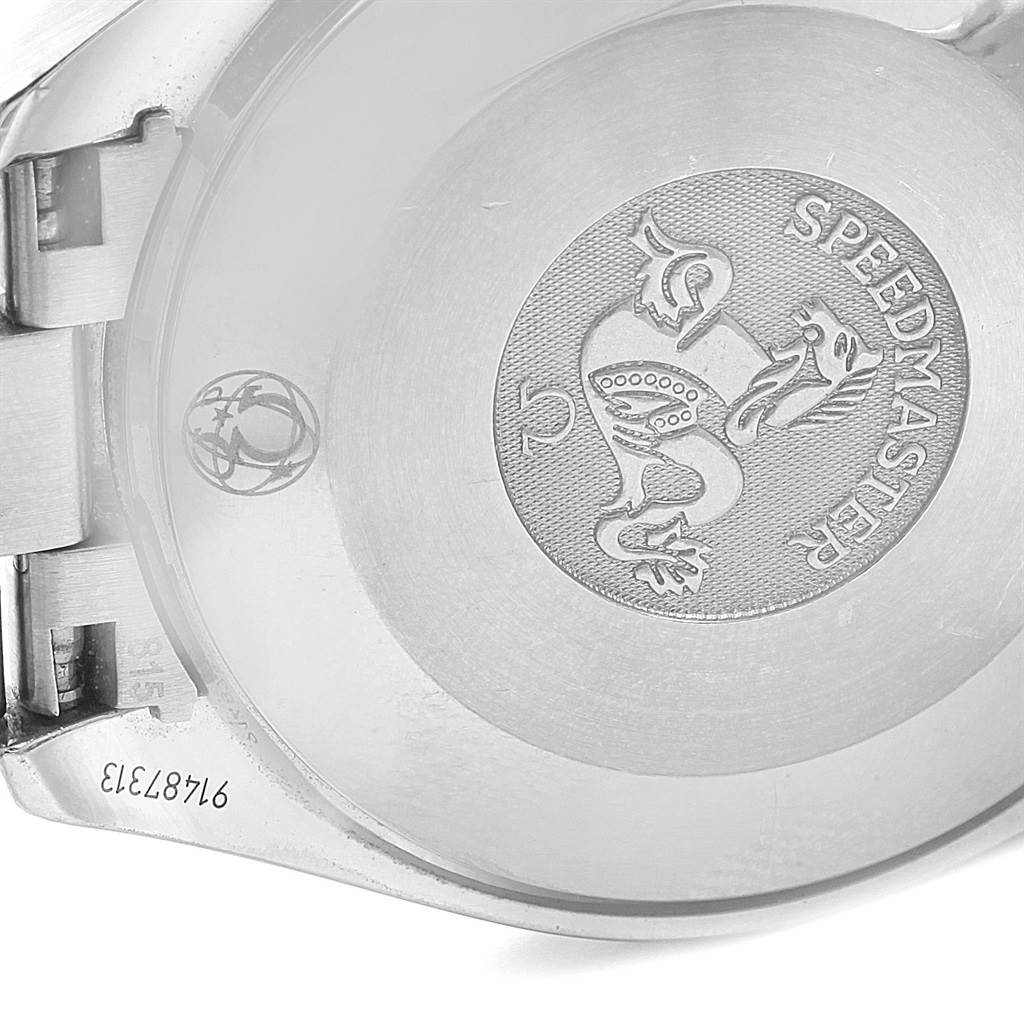 The image shows the case back of an Omega Speedmaster 3539.50.00 Men
s Stainless Steel Black Dial 3539.50.00 Men
s Stainless Steel Black Dial watch, highlighting its engraved emblem and serial number.