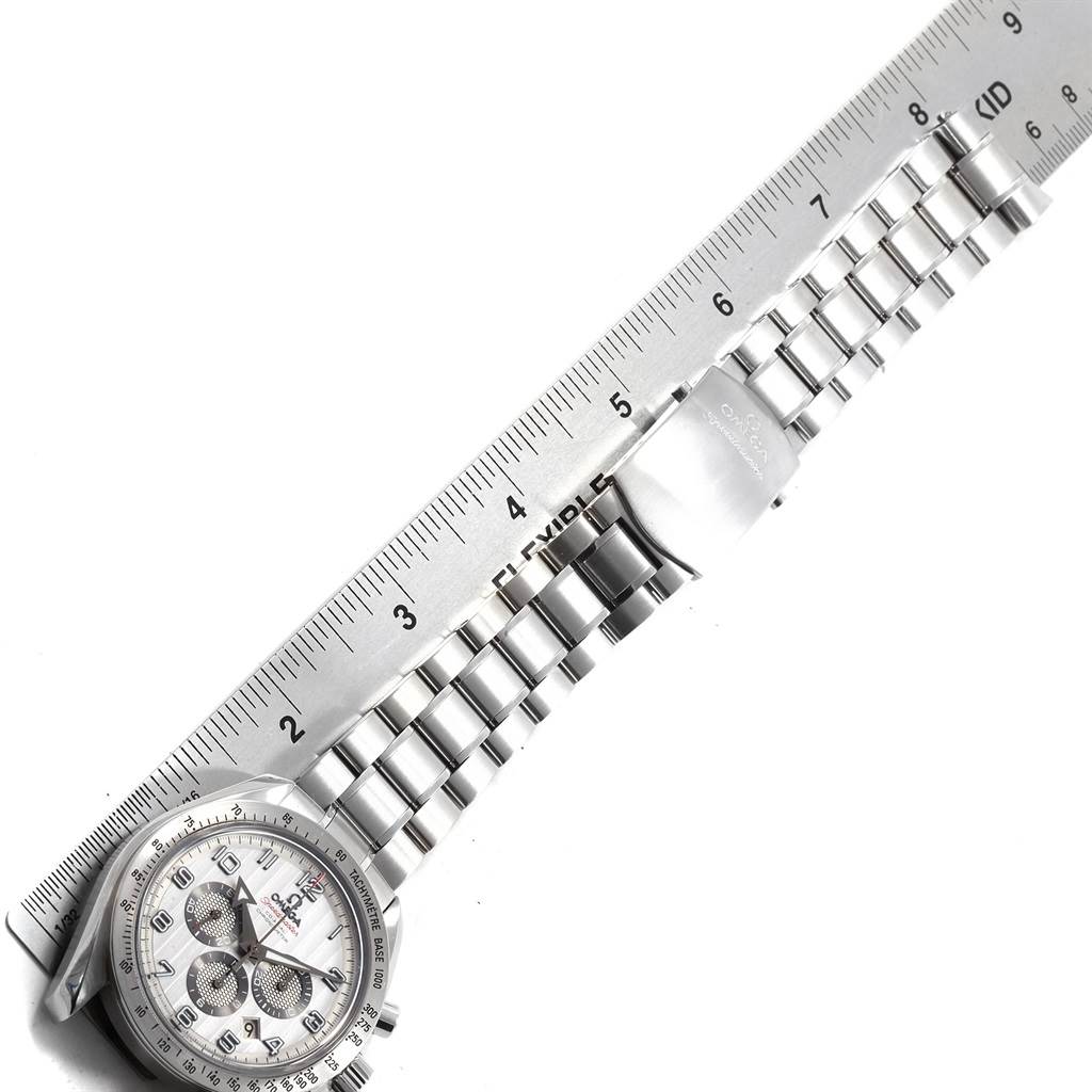 The image shows an Omega Speedmaster 321.10.44.50.02.001 Men
s Stainless Steel Silver Dial 321.10.44.50.02.001 Men
s Stainless Steel Silver Dial watch laid flat with a ruler beside it, displaying the face, bracelet, and clasp.