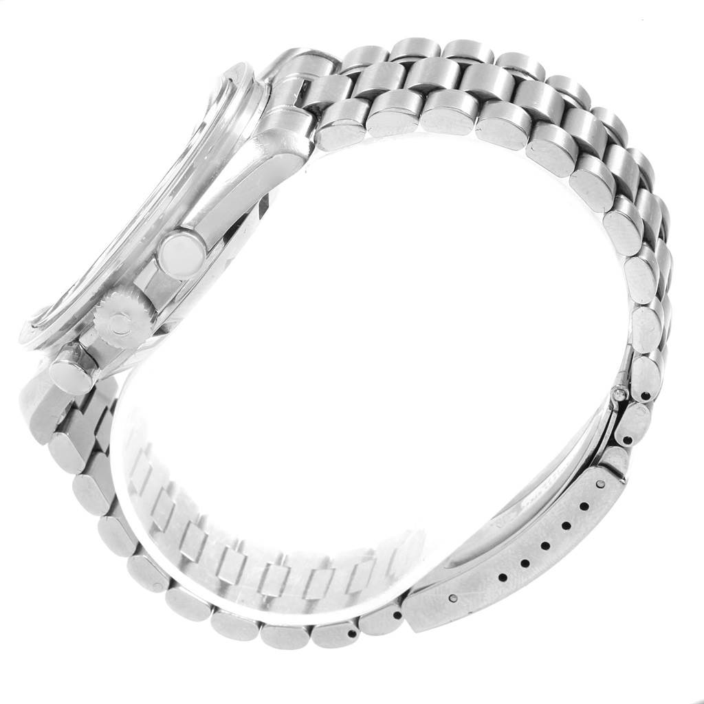 The image shows a side profile of an Omega Speedmaster 145.022 Men
s Stainless Steel Black Dial 145.022 Men
s Stainless Steel Black Dial watch, highlighting the metal bracelet, clasp, and side buttons.