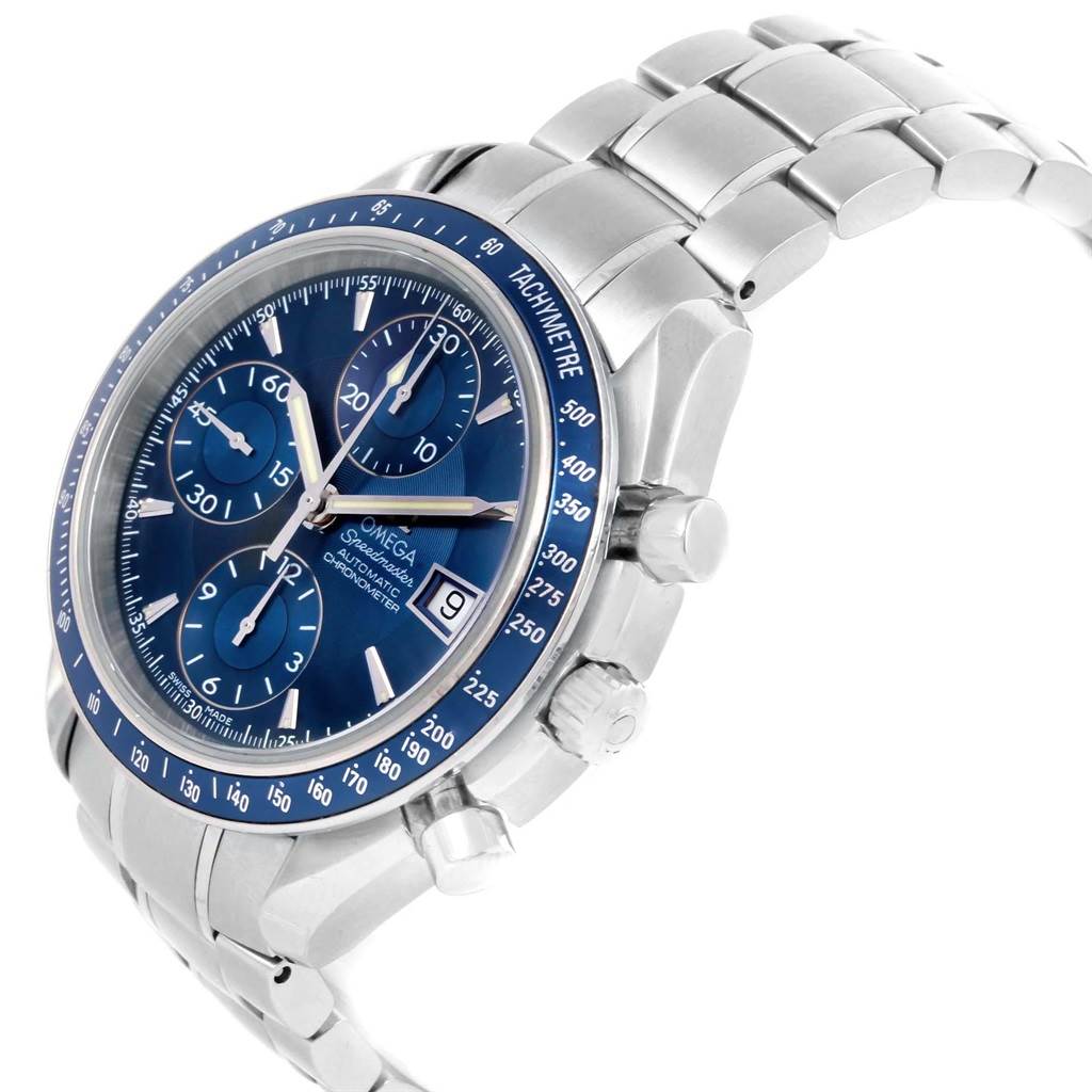 The image shows an Omega Speedmaster 3212.80.00 Men
s Stainless Steel Blue Dial 3212.80.00 Men
s Stainless Steel Blue Dial watch at an angled view, highlighting its blue dial, subdials, tachymeter bezel, and metal bracelet.