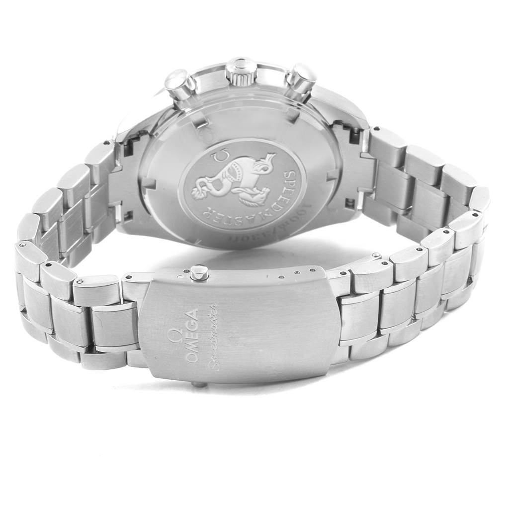 The image shows the back case and bracelet of the Omega Speedmaster 3212.80.00 Men
s Stainless Steel Blue Dial 3212.80.00 Men
s Stainless Steel Blue Dial watch, featuring its iconic engraved emblem and branded clasp.