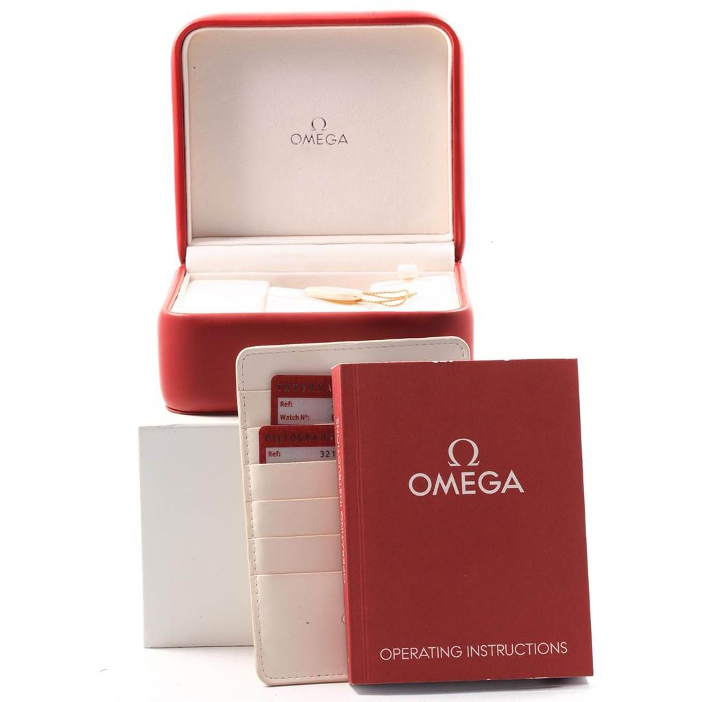 The image shows the Omega Speedmaster 3212.80.00 Men
s Stainless Steel Blue Dial 3212.80.00 Men
s Stainless Steel Blue Dial watch box, operating instructions, and warranty cards from a frontal angle.