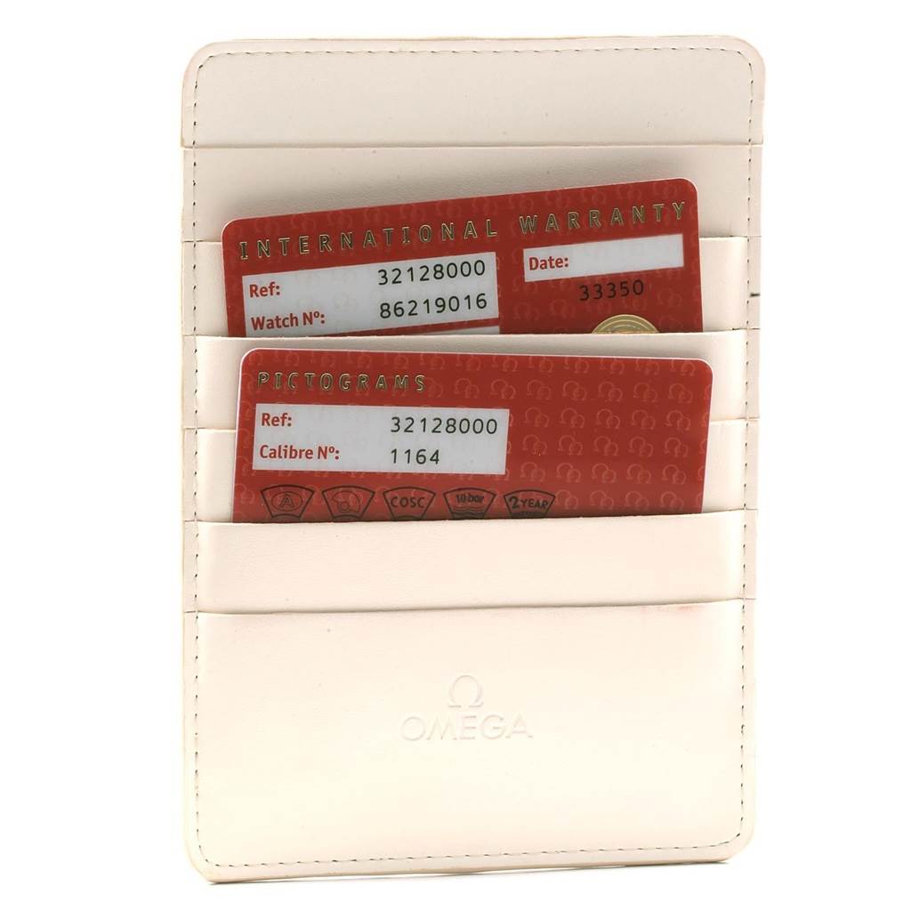 The image shows an Omega Speedmaster 3212.80.00 Men
s Stainless Steel Blue Dial 3212.80.00 Men
s Stainless Steel Blue Dial international warranty card and pictogram card in a white cardholder.