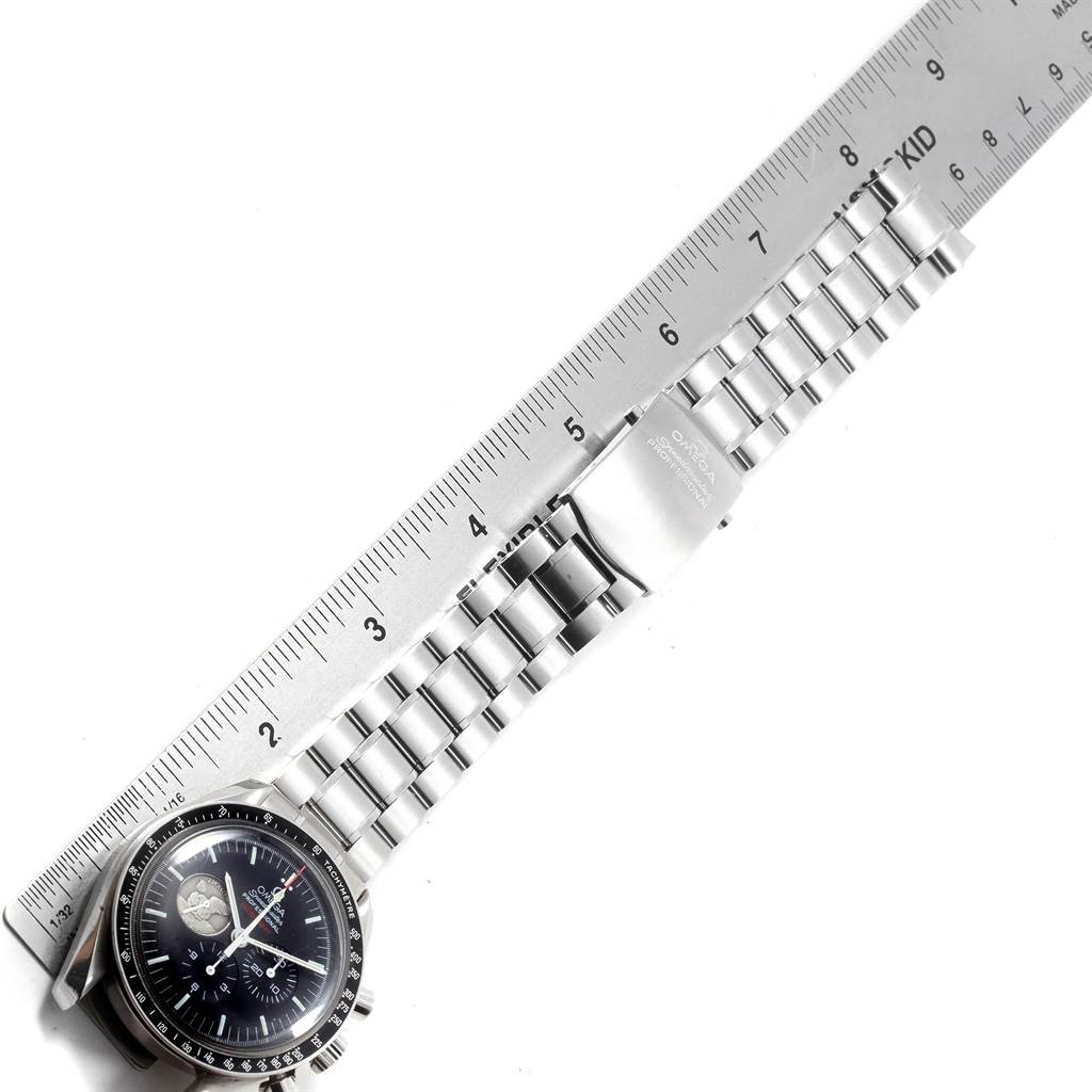 The Omega Speedmaster 311.30.42.30.01.002 Men's Stainless Steel Black Dial 311.30.42.30.01.002 Men's Stainless Steel Black Dial watch and stainless steel bracelet are shown from a top-down angle alongside a measurement ruler.